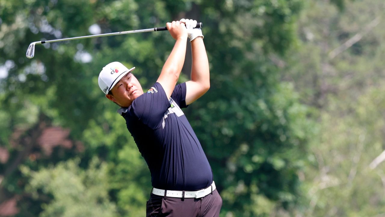 Sungjae Im plays his tee shot on the 9th hole during the Rocket Mortgage Classic.