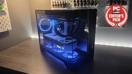 A Phanteks XT V3 PC case on a desk with various PC parts.
