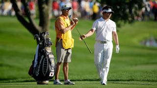 Photo of Y.E. Yang using one of his many hybrids to defeat Tiger Woods at the 2009 PGA Championship.