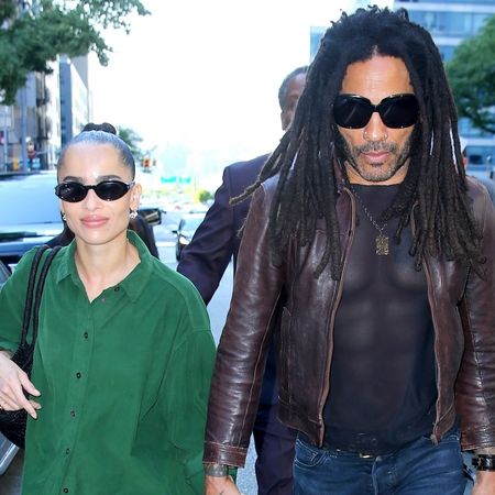 Zo&euml; Kravitz with Lenny Kravitz wearing an oversized green button-up shirt with baggy jeans and black sneakers in New York City September 2024