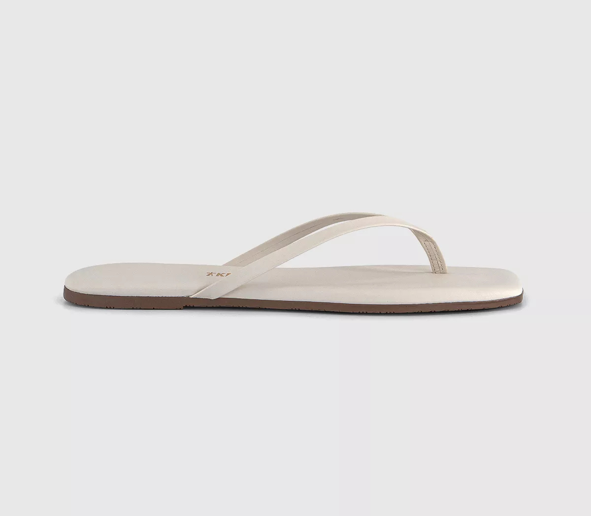 A pair of white Tkees flip-flop sandals