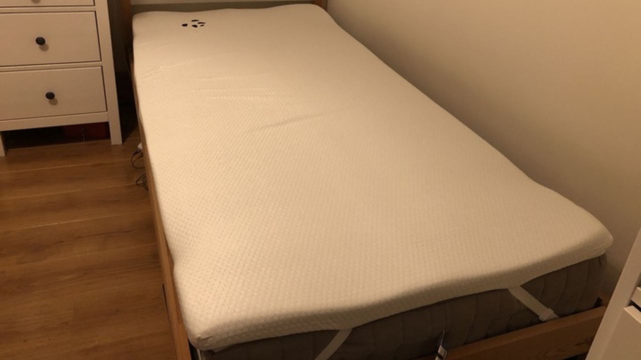 The Panda London Bamboo Mattress Topper on a twin-sized mattress in a tester's bedroom.