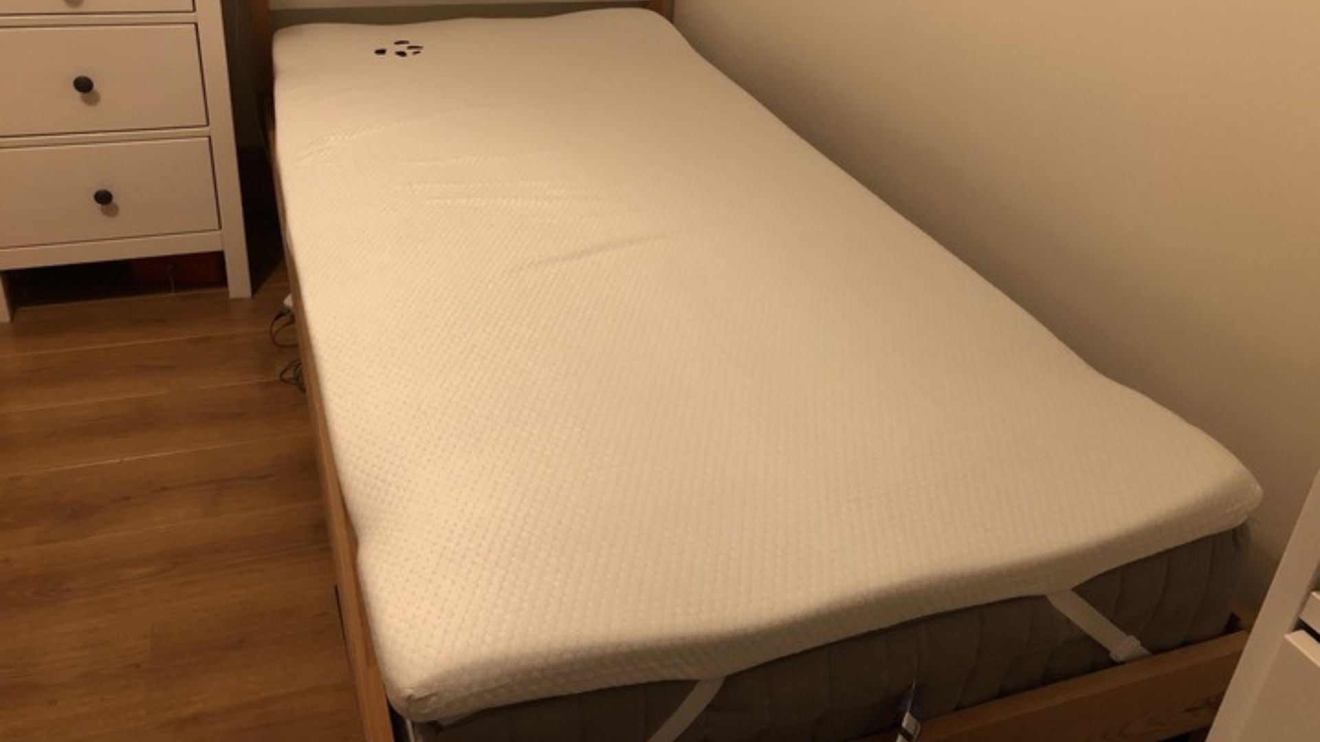 The Panda London Bamboo Mattress Topper on a twin-sized mattress in a tester's bedroom.