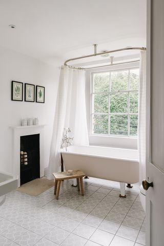 white bathroom with circular shower rail