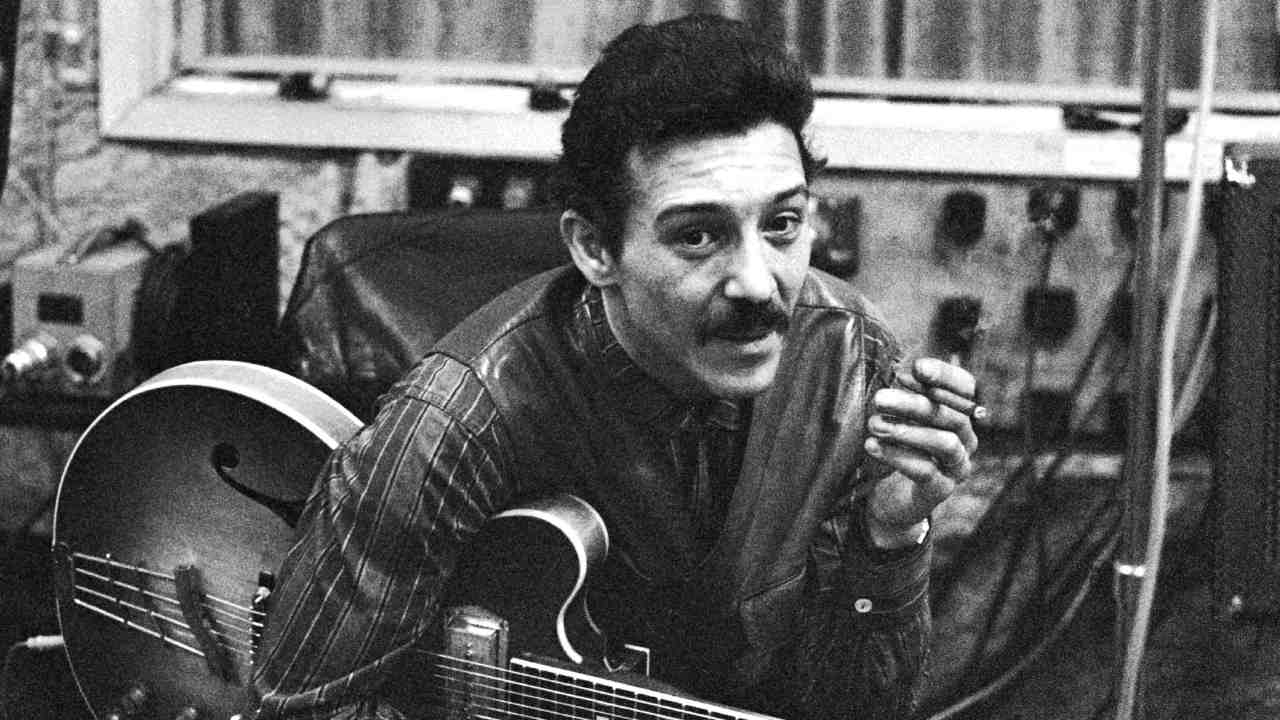 Alexis Korner posing for a photograph in the 1960s