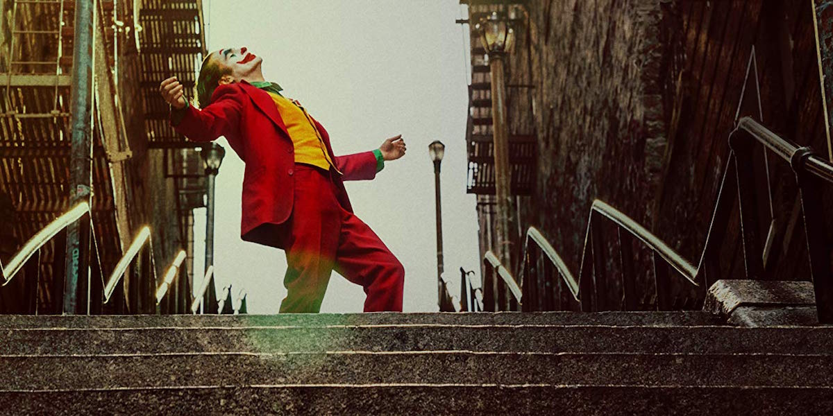 Joaquin Phoenix dancing on stairs as Joker