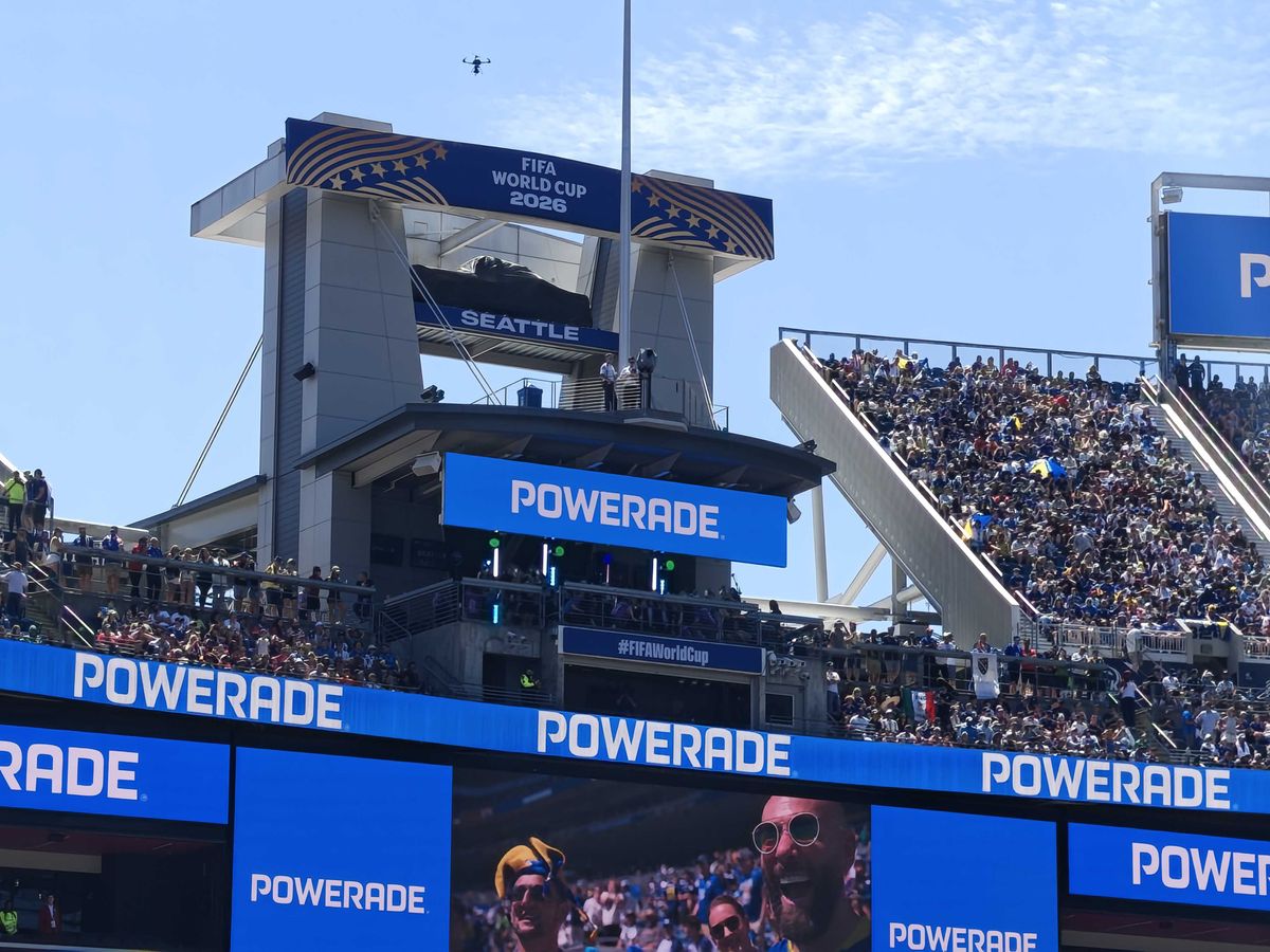 Spectators high up in the stands with Powerade ads everywhere