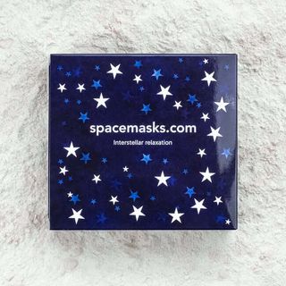 A box of blue jasmine scented Spacemasks against a cream textured background