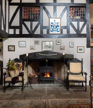 dining hall fireplace in Elizabethan manor - Britain's oldest home