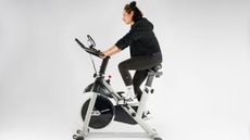Our expert fitness reviewer testing the YOSUDA bike