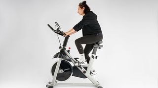 Our expert fitness reviewer testing the YOSUDA bike