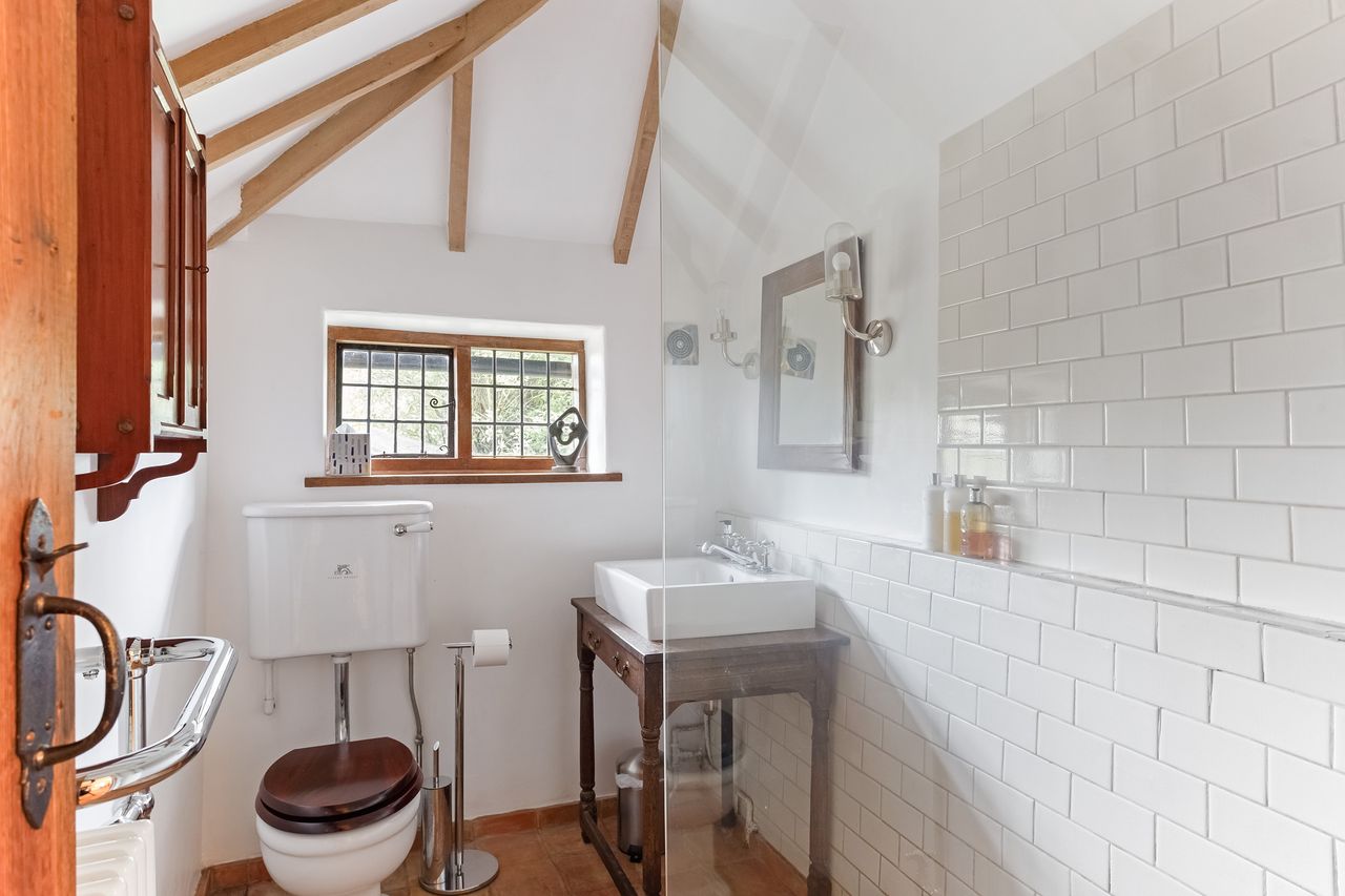 Images of a very wonky house called The Cottage