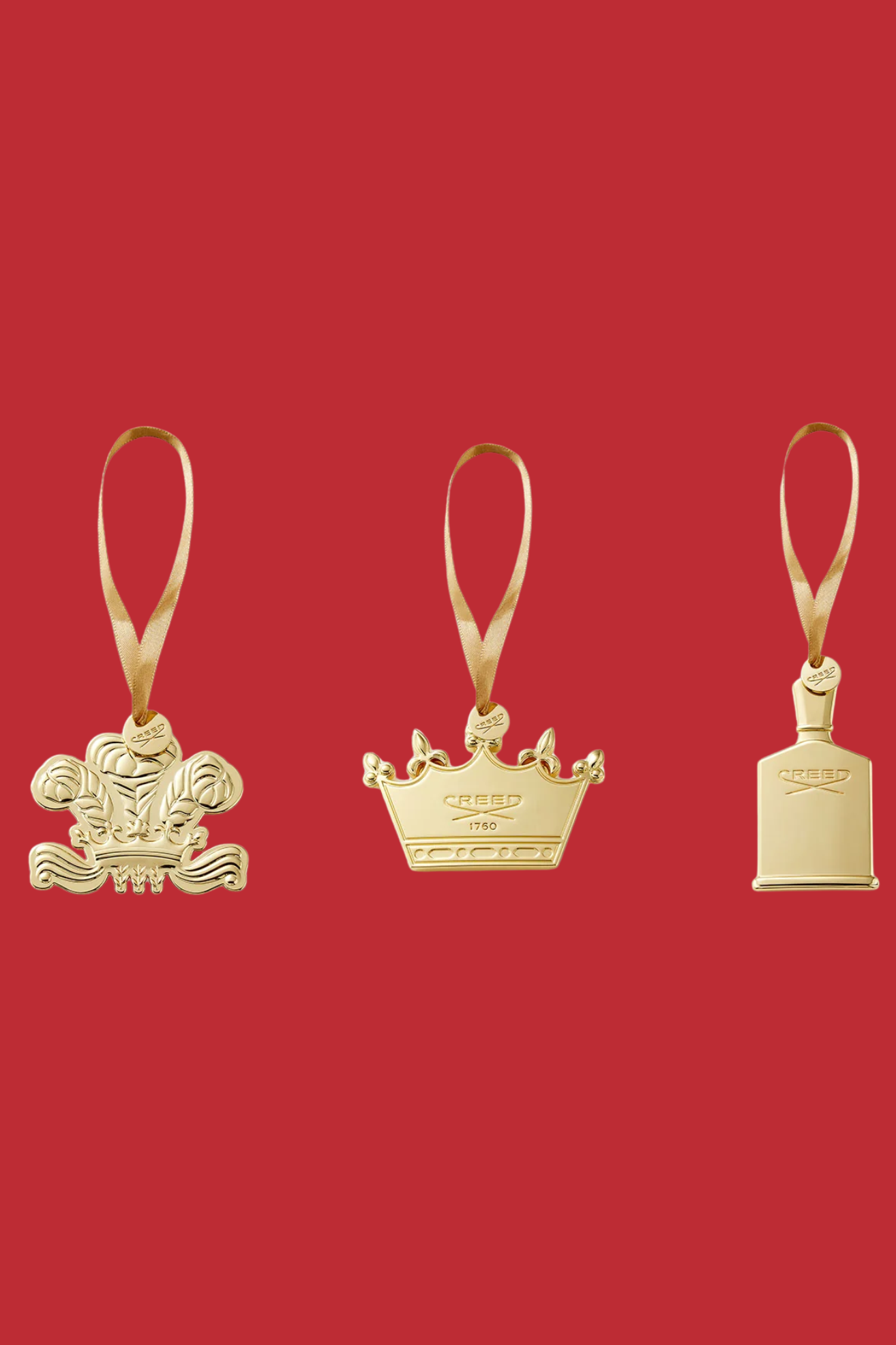 A set of three Creed-inspired gold scented ornaments