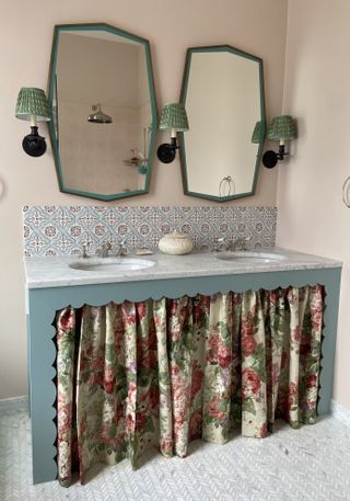 Green twin mirror and lamps, blue tiled splashback