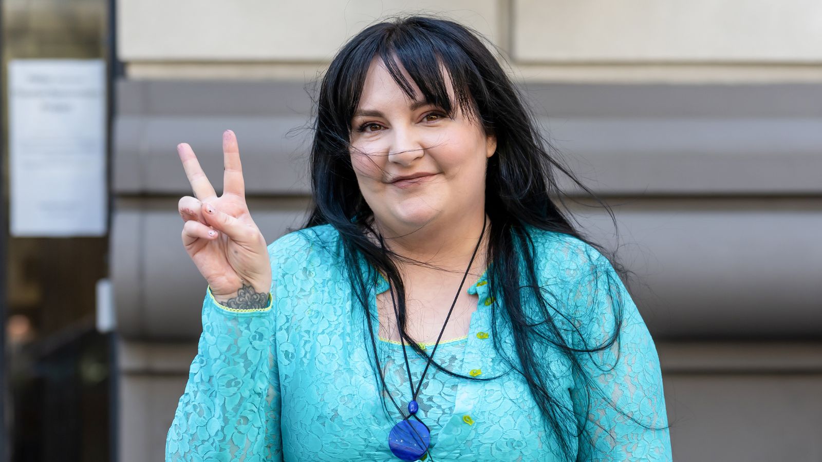 lena dunham on a gray background