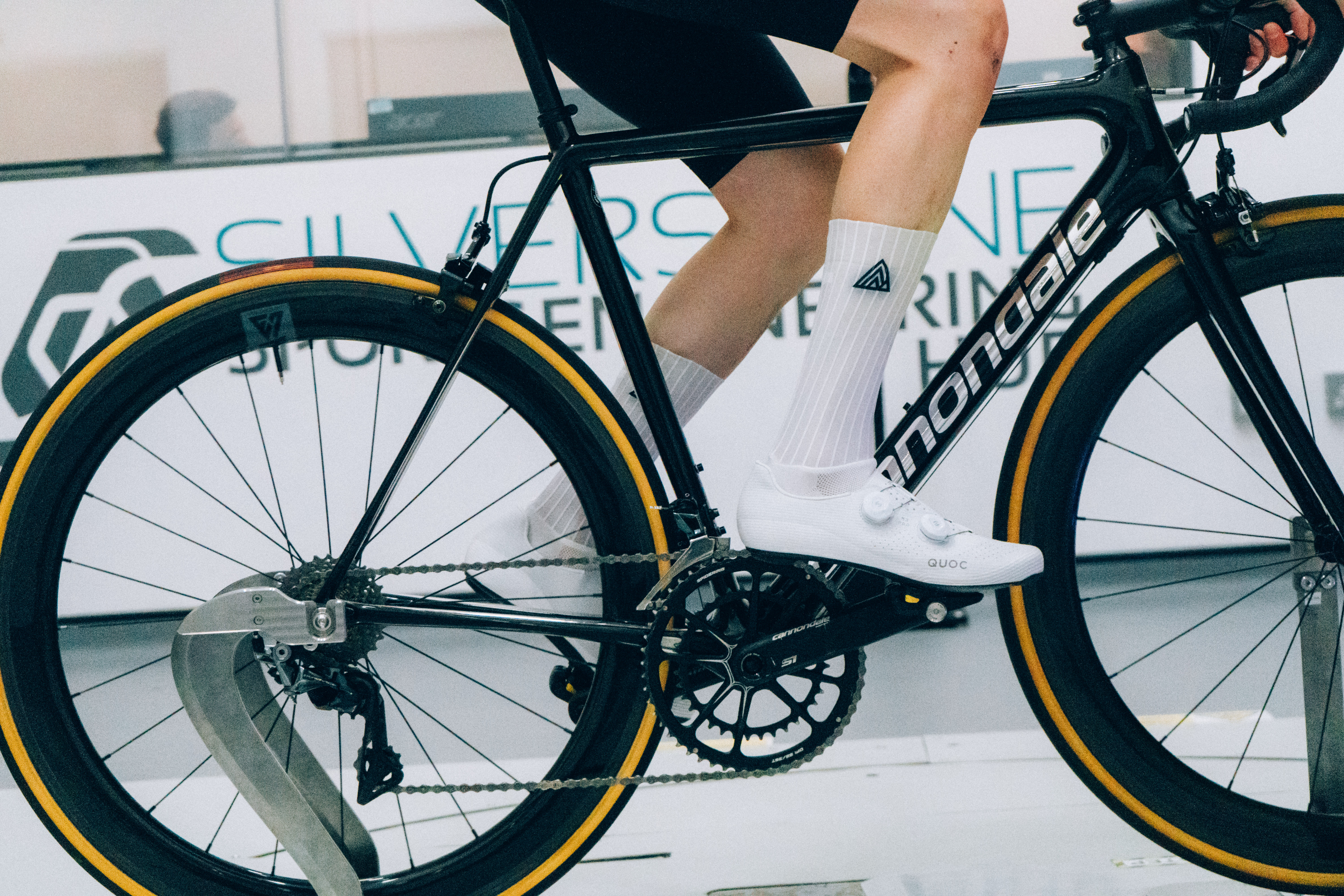 A close up of the socks that Tom is wearing while riding a bike in the wind tunnel