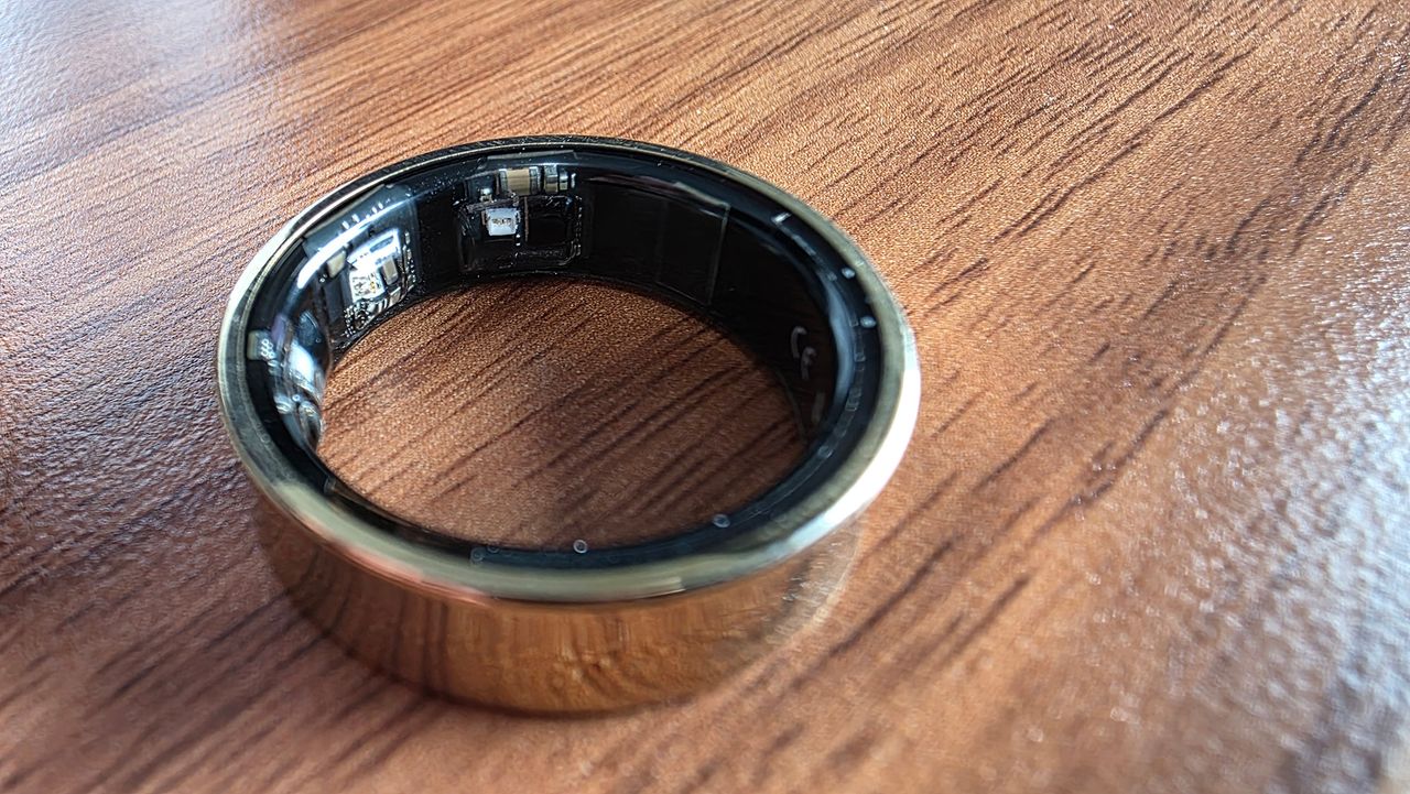 Macro photo of a Samsung Galaxy Ring on a desktop.