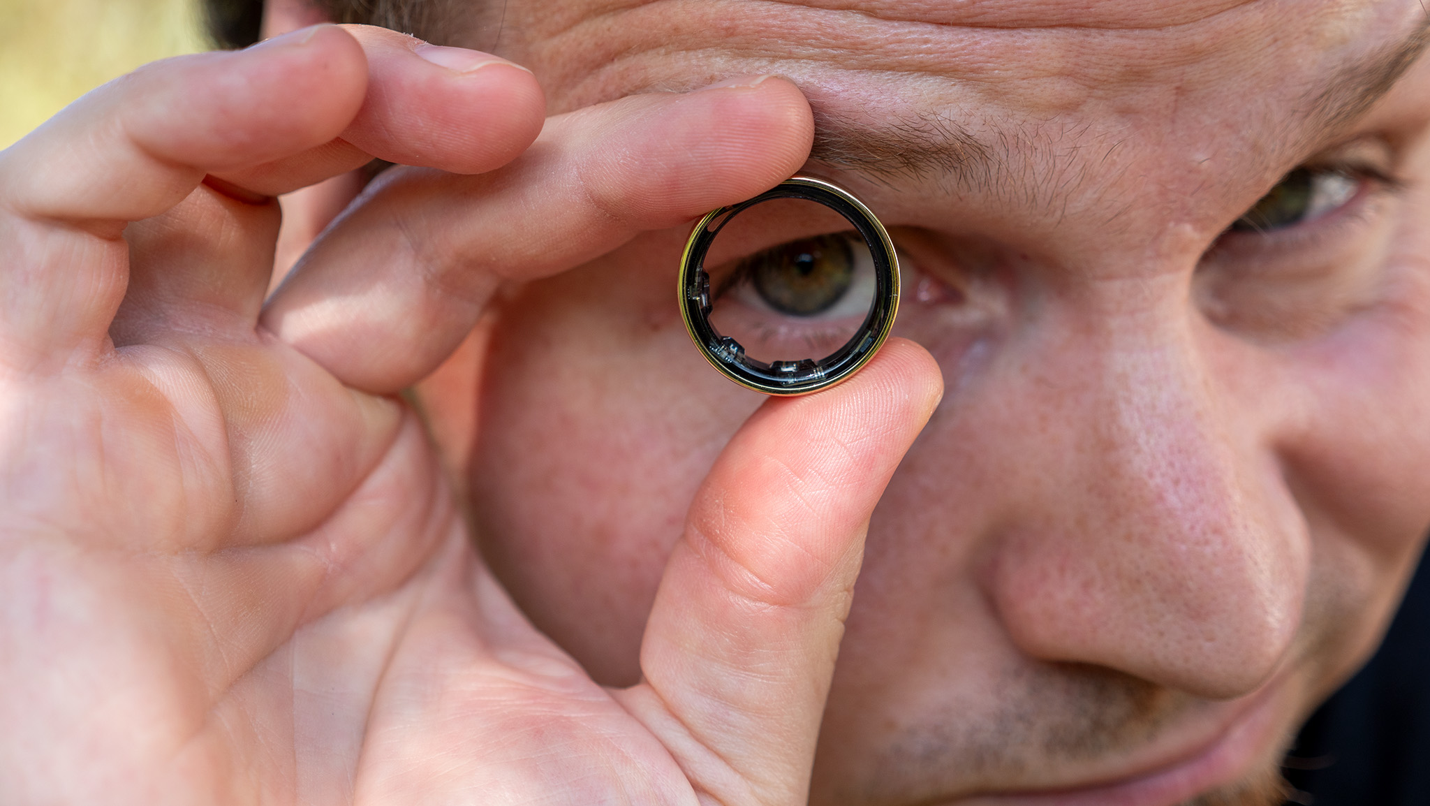 Looking through the gold Samsung Galaxy Ring