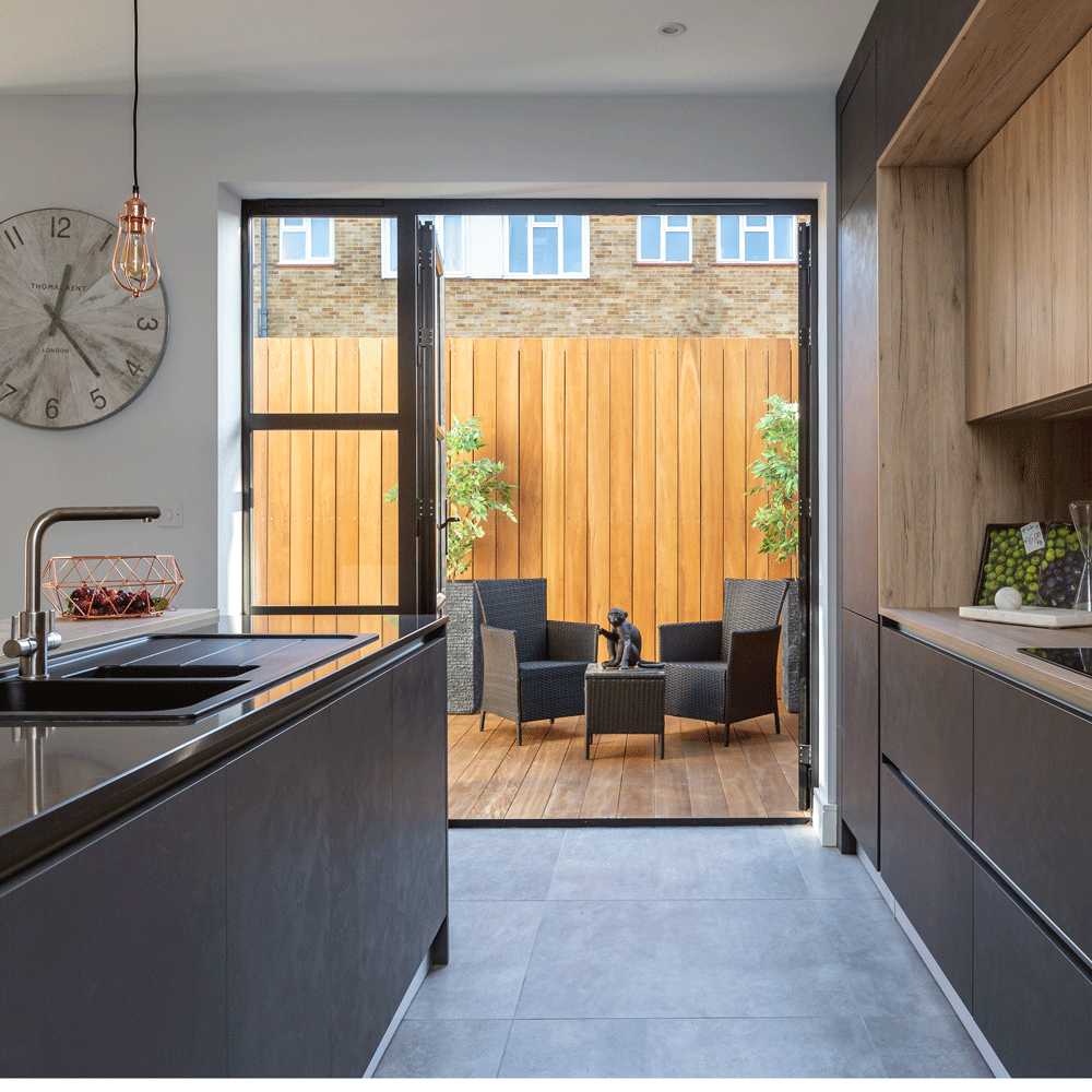 kitchen with tiled flooring and wall clock
