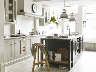 grey kitchen island with shaker cabinetry and chrome pendant lights