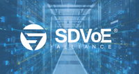 The SDVoE Alliance logo over a warehouse.