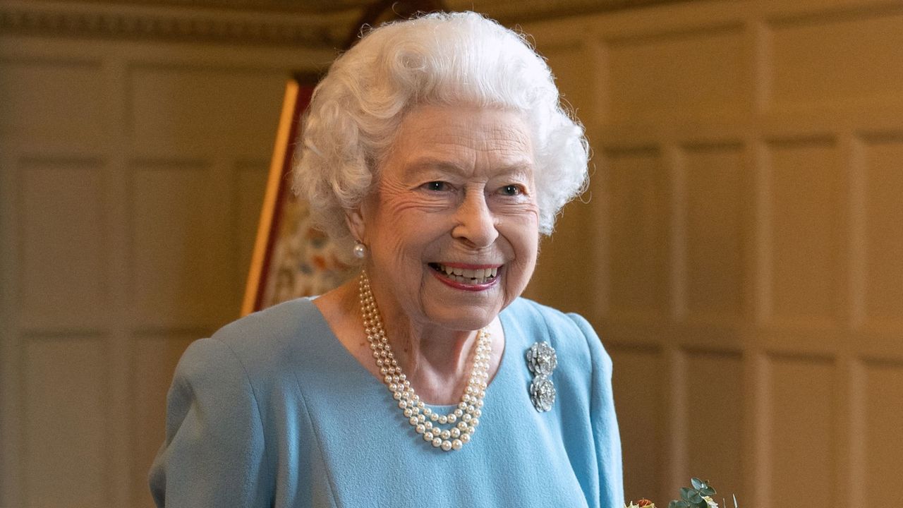 Queen Elizabeth II talks to members of the West Norfolk Befriending Society as she celebrates the start of the Platinum Jubilee at a reception in the Ballroom of Sandringham House, the Queen&#039;s Norfolk residence on February 5, 2022. - Queen Elizabeth II on Sunday will became the first British monarch to reign for seven decades, in a bittersweet landmark as she also marked the 70th anniversary of her father&#039;s death. 