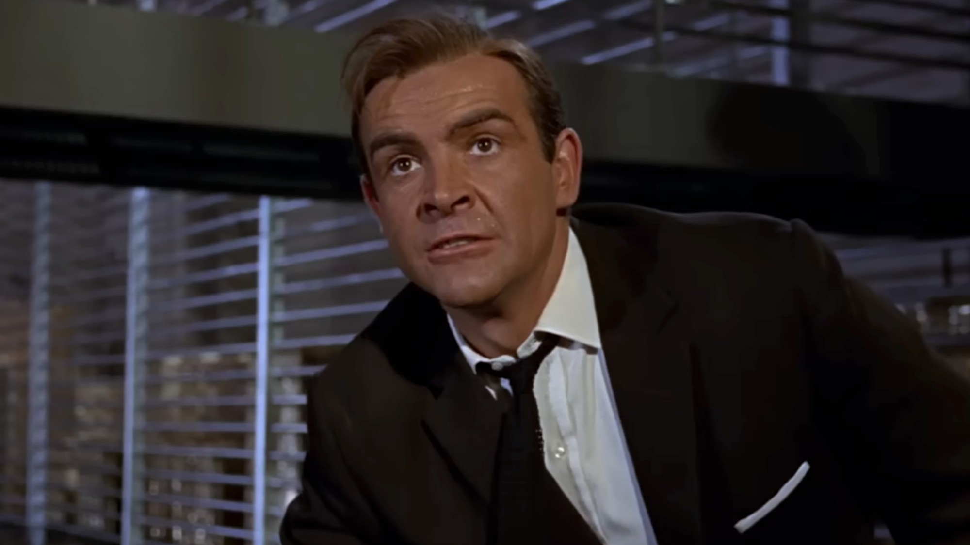 Sean Connery in a dark suit in Goldfinger