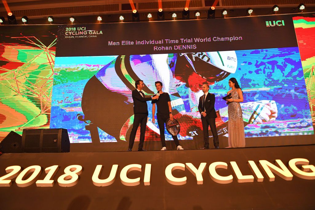 Miles Scotson receives the award for men's time trial world champion on behalf of Rohan Dennis