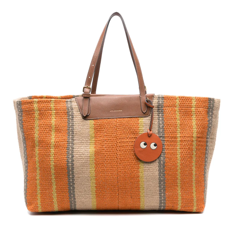 Anya Hindmarch striped orange tote bag with smiley face charm