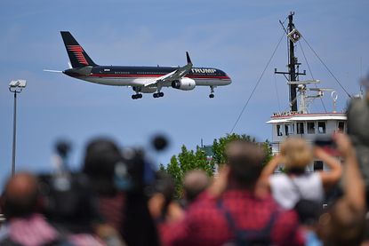 Donald Trump's plane flew overhead just as Ted Cruz mentioned him below.