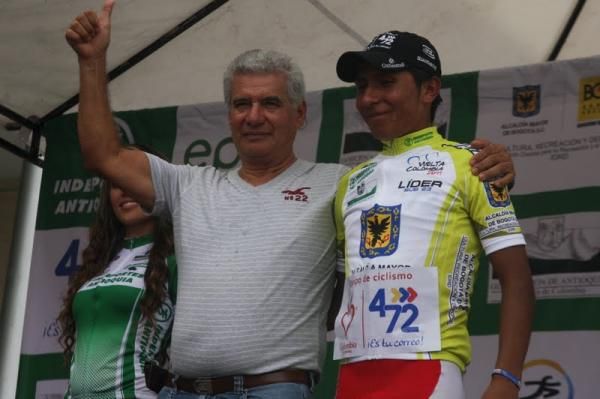 The race organiser on the podium with the current points classification leader.