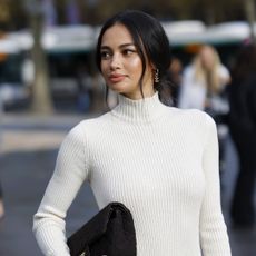 Kelsey Merritt wears white turtleneck long sleeves sweater dress with glowy skin - vieve super skin nova review