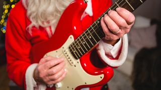 Santa playing a red Stratocaster