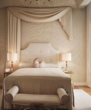 Cream bedroom, draping, cushioned headboard