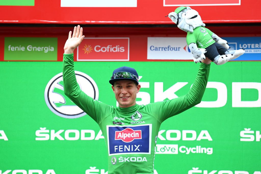 ALBACETE SPAIN AUGUST 18 Jasper Philipsen of Belgium and Team AlpecinFenix celebrates winning the Green Points Jersey on the podium ceremony after during the 76th Tour of Spain 2021 Stage 5 a 1844km stage from Tarancn to Albacete lavuelta LaVuelta21 on August 18 2021 in Albacete Spain Photo by Stuart FranklinGetty Images