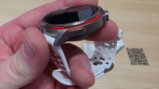 The Huawei Watch GT Runner 2 on a stand.