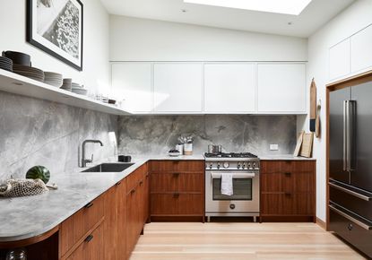 Coffee Mug In Modern Trendy Kitchen With Grey Cupboards And Wood