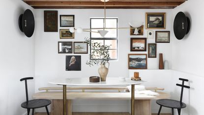 Rustic style dining nook with gallery wall