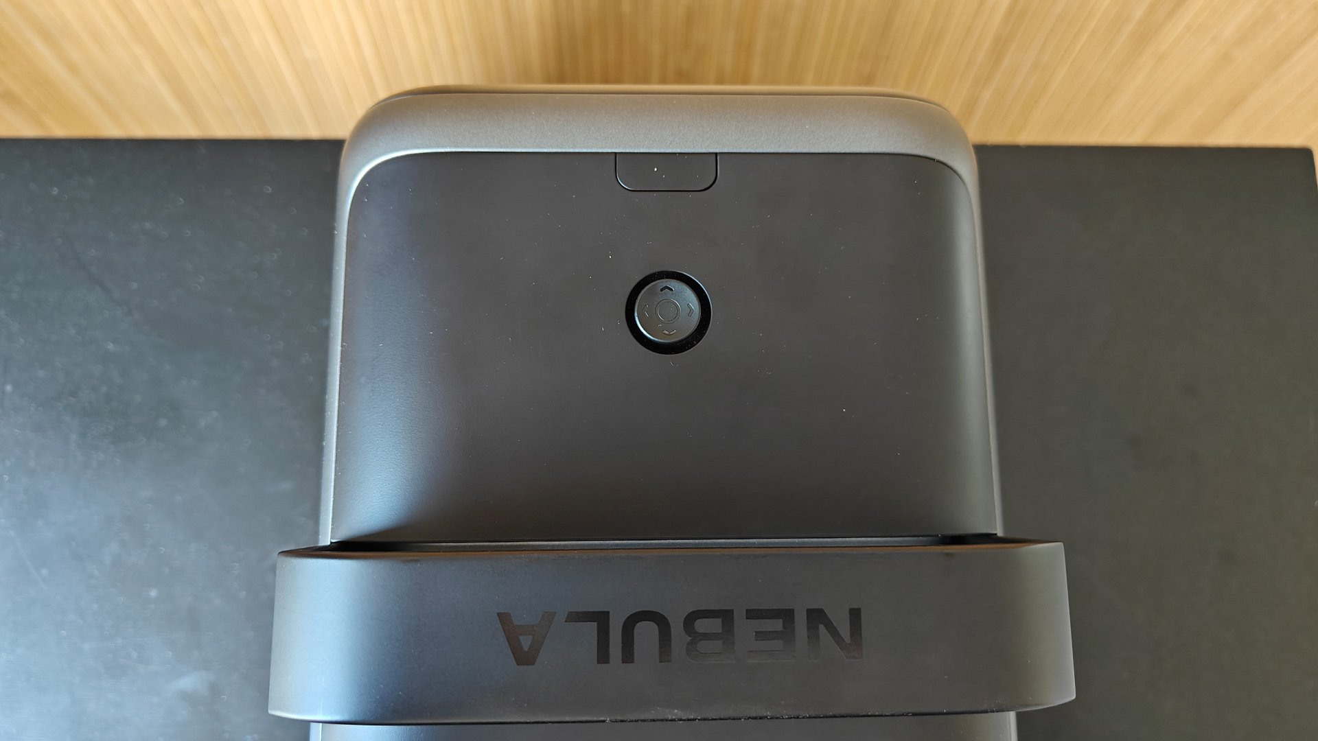 Nebula X1 home cinema projector top-down view showing power button and Nebula logo