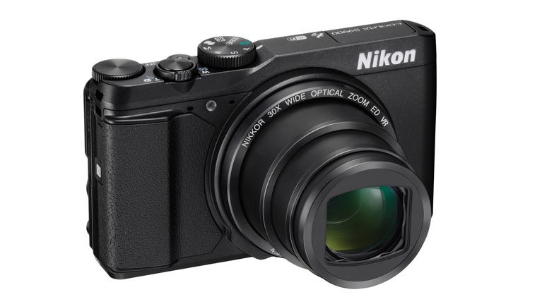 Nikon Coolpix S9900 featuring a 30x optical zoom lens, sleek design, and various control buttons on top