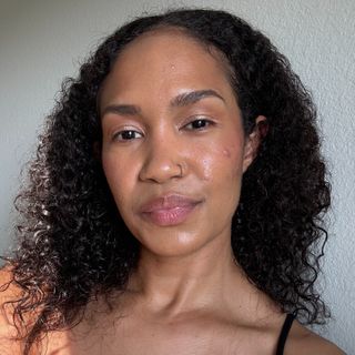 A beauty editor wears Bread Beauty Supply's Leave-In Conditioning Curl Styling Cream.