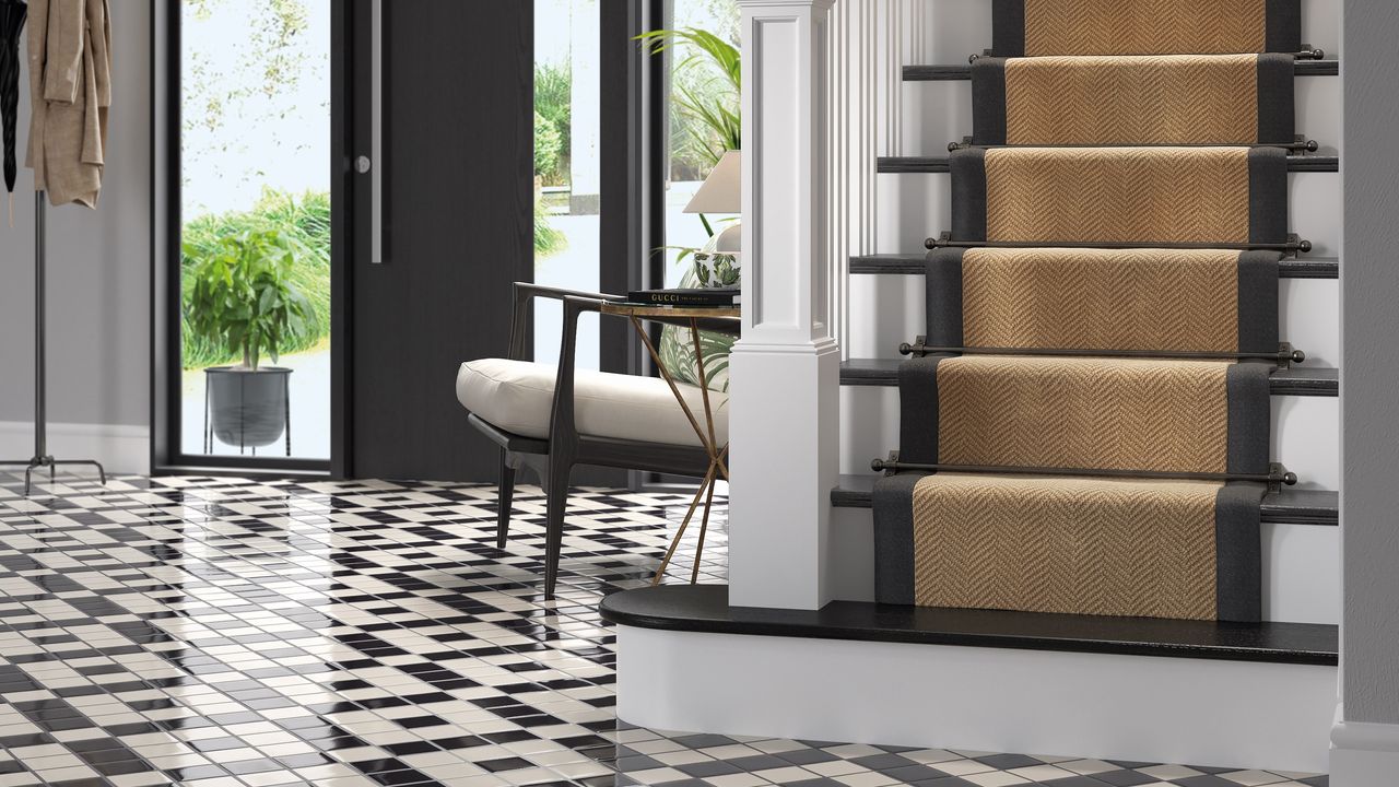 Staircase in hallway with black and white floor