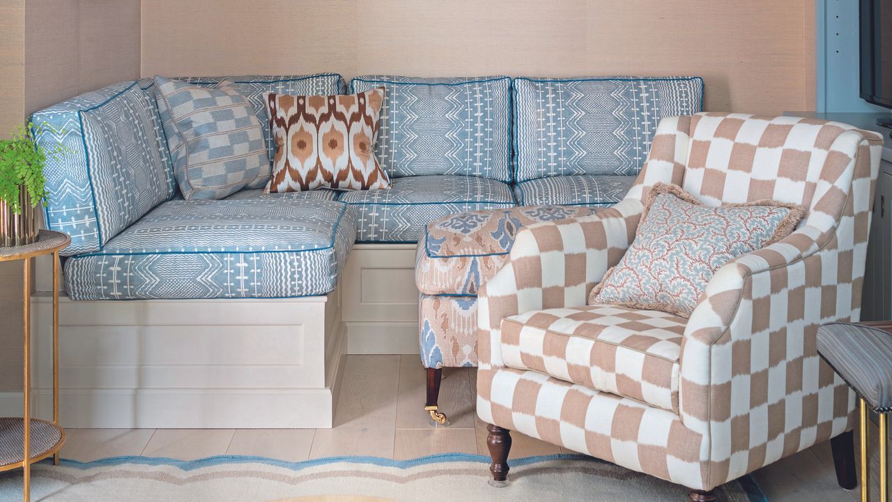 Living room with clashing sofa and armchair prints