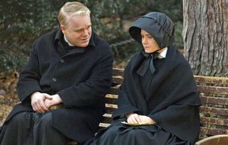 philip seymour hoffman as a priest as he talks to amy adams as a nun in doubt