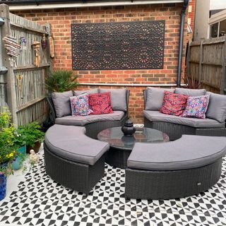 garden with painted patio and round sofa set