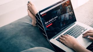 Woman watching Netflix on her laptop