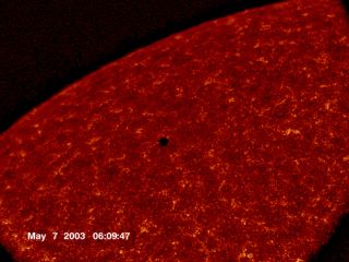 The planet Mercury transiting in front of the sun in 2003, as captured by a NASA satellite.