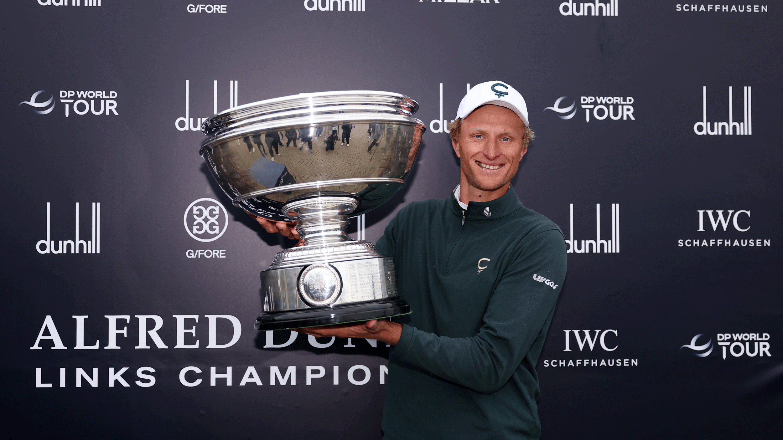 Adrian Meronk poses with the Alfred Dunhill Links Championship trophy in 2026