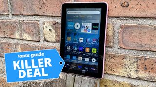 A photo of the Amazon Fire 7 Tablet leaning up against a wall.