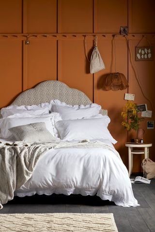 Terracotta bedroom walls with bedlinen by Secret Linen Store